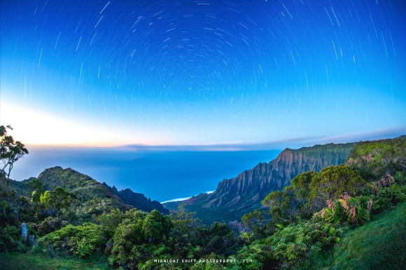 A photo of Stars trails captured at Kalalau Lookout on the island of Kauai, Hawaii.